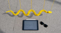 jesús rafael soto suspends 4,000 yellow strands in kensington gardens for serpentine